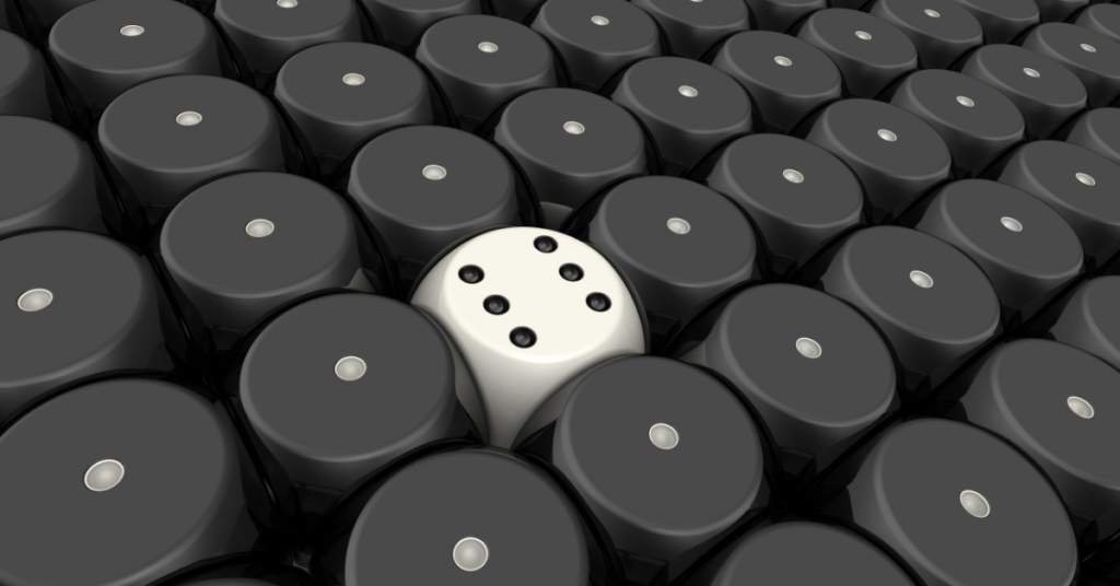 Many black dice surrounding one white die.