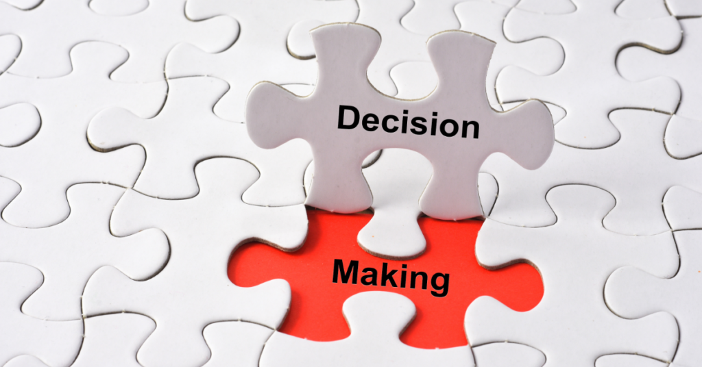 white puzzle pieces with one out of place. The words Decision Making are written on the pieces. Three Critical Decisions when starting up your analytics team