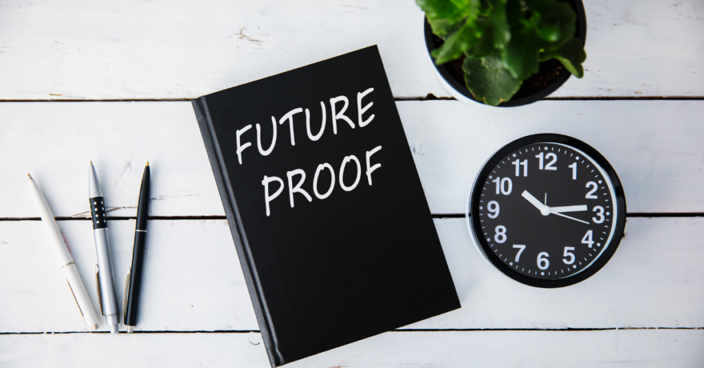 Future-proof your business with organization wide analytics training - a notebook, clock, and pens on a desk