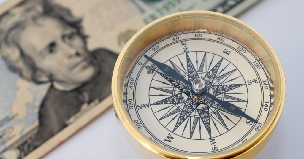 Budgeting for Organization-Wide Analytics Training. An image of a compass pointing toward a twenty dollar bill.