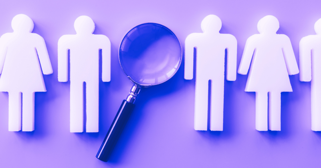 Making Your First Analytic Hire. Silhouettes of male and female stick figures with a magnifying glass on a purple background.