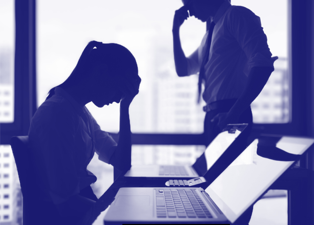 Man and woman frustrated at work